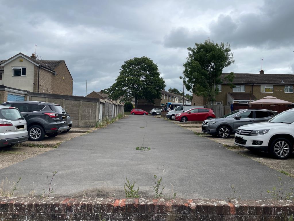 Lot: 47 - COMPOUND OF NINE LOCK-UP GARAGES AND NINETEEN PARKING SPACES - General view of compound towards Bybrook Road